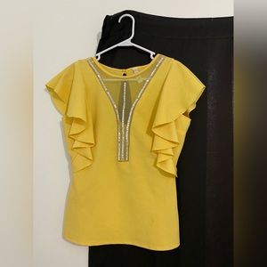 Yellow with rhinestone in front. From Steps NY. SIZE LARGE, fits M also